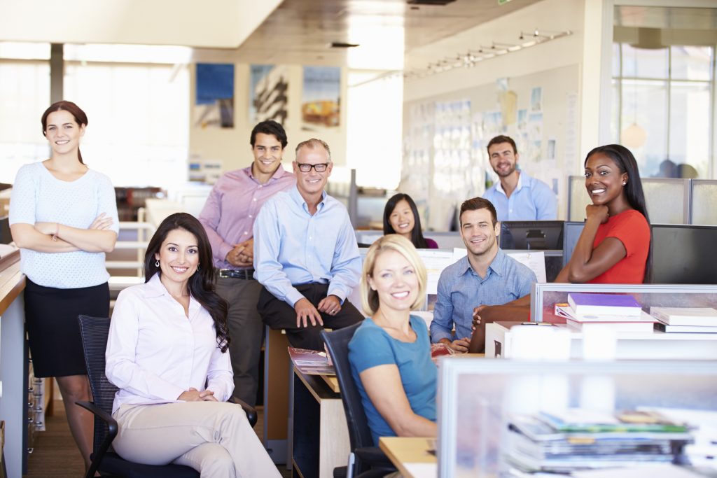 Portrait Of Business people In Modern Open Plan Office